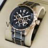 ساعه من ِGuess Collection تعمل بعدادات بلون اسود وسير اسود×دهبي من المعدن | Watches Prime